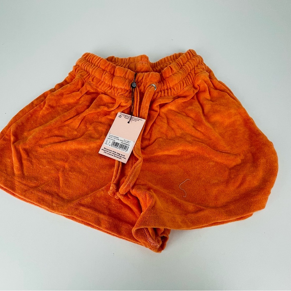 TOWELLING FLARE JERSEY SHORTS
BURNT ORANGE